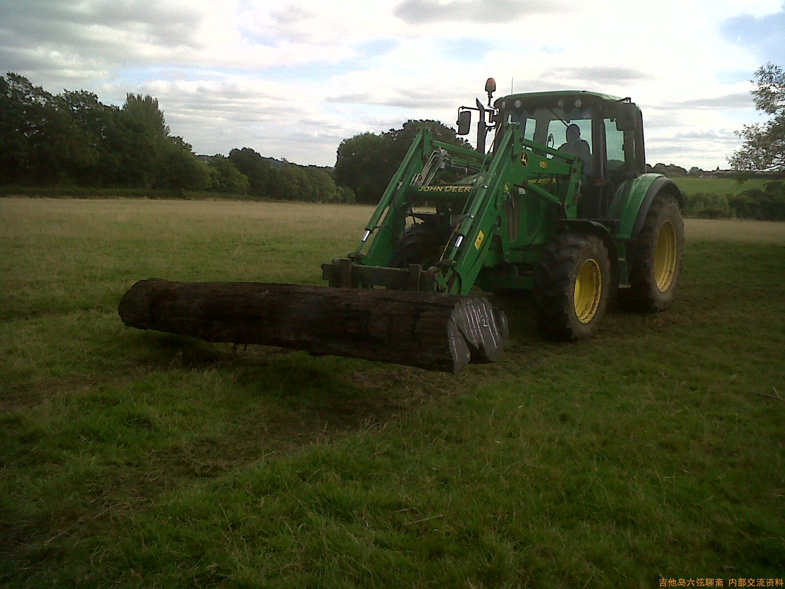 tractor moving log.jpg